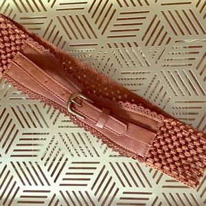 Brown woven belt with front leather buckle.